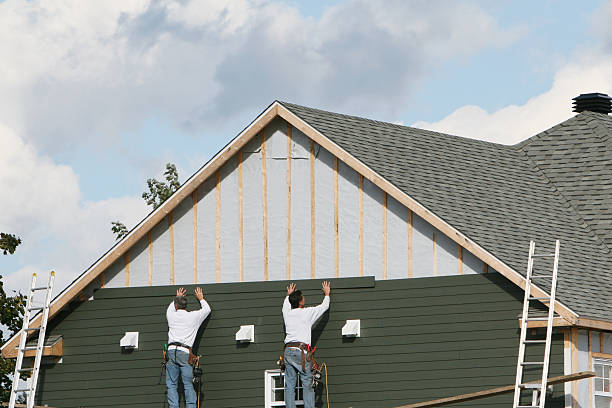 Professional Siding Installation technician working in Cabin John, MD